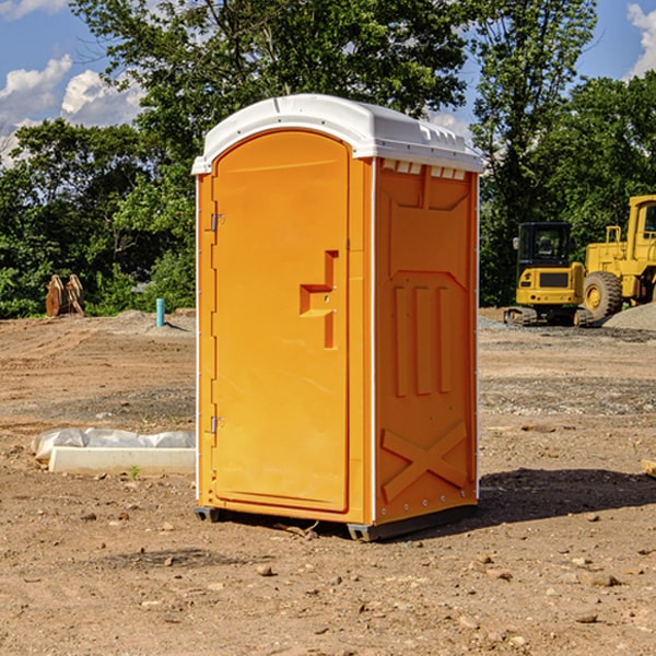 what is the cost difference between standard and deluxe portable restroom rentals in Rainbow City